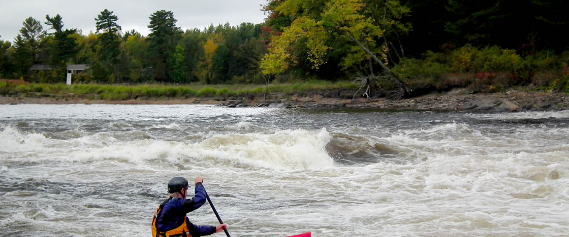 A kayaker paddles a set of rapids on the Ottawa River