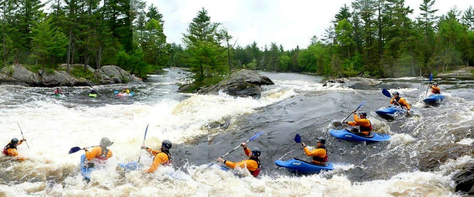 Timelapse image showing a kayaker navigating rapids on the Ottawa River